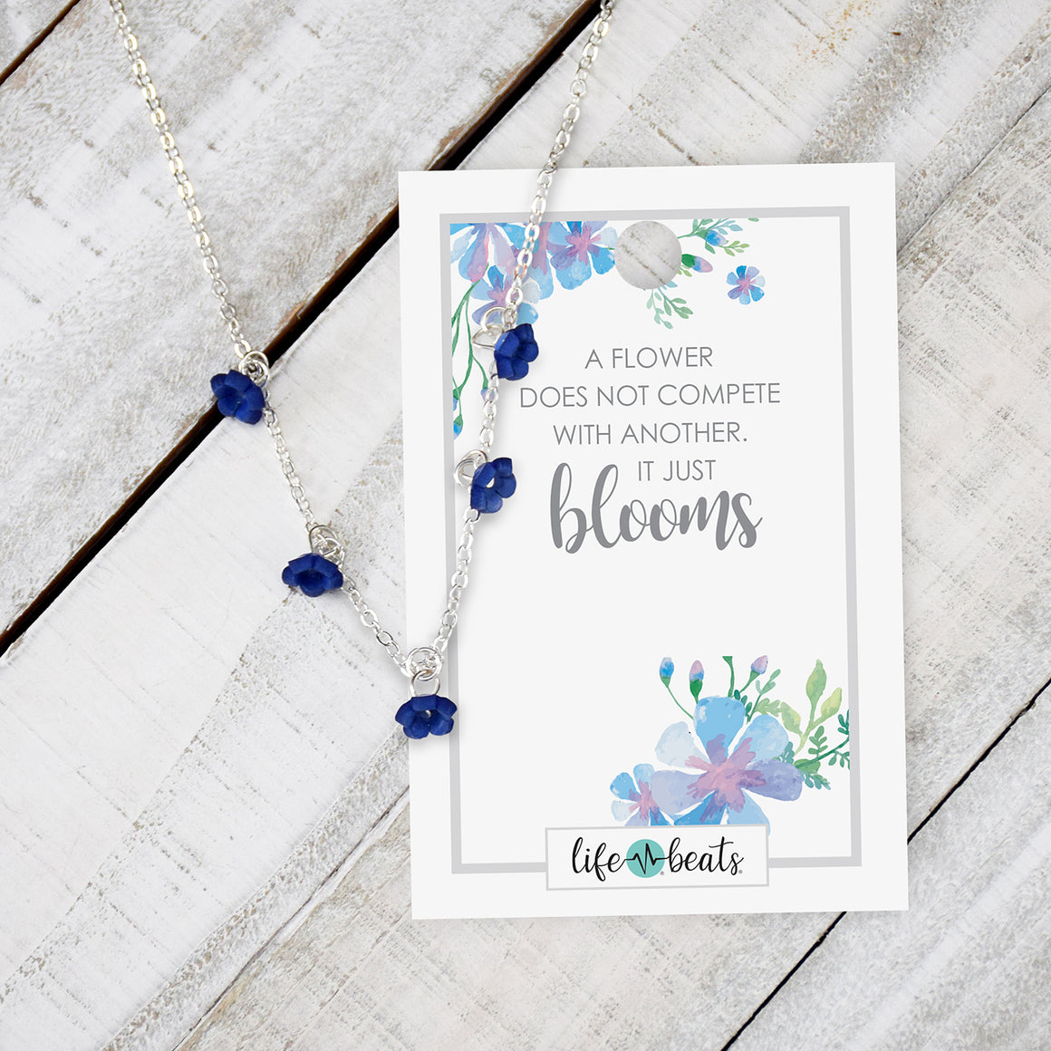 Dainty Flower Charm Necklace - Blue flowers on a silver finish chain